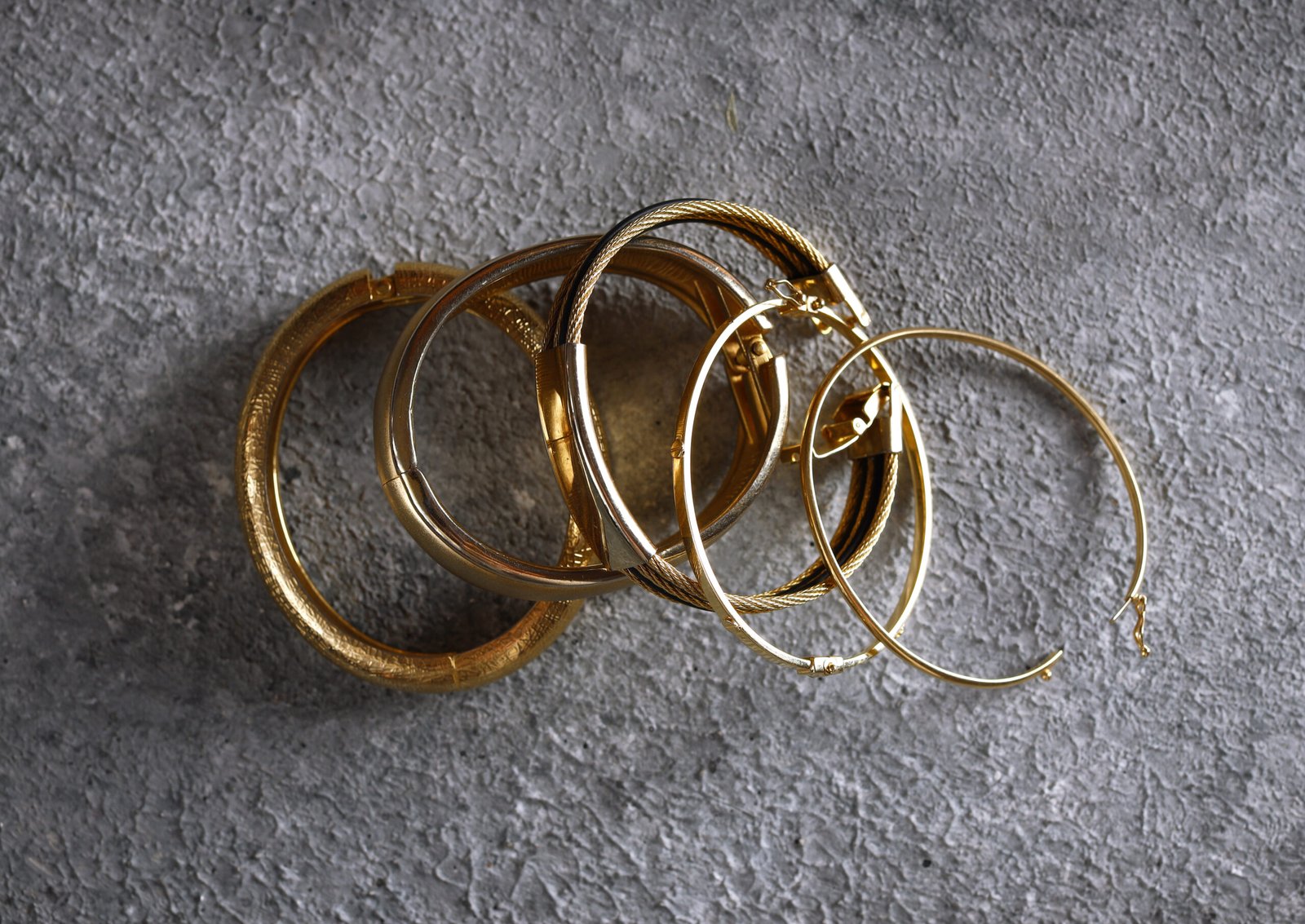 gold jewelry bracelets and chains and rings